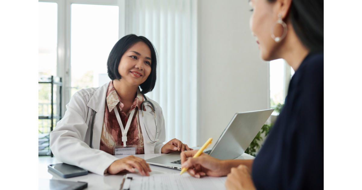 Confident business owner asking questions of a smiling vendor