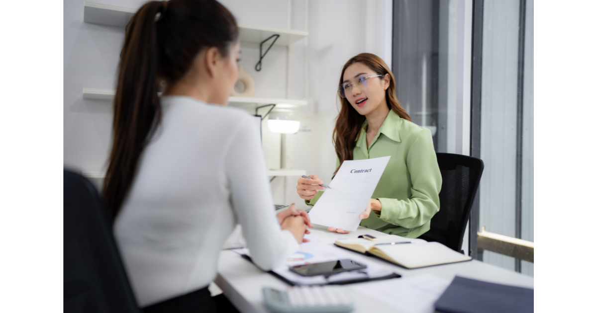 Business women reviewing a contract